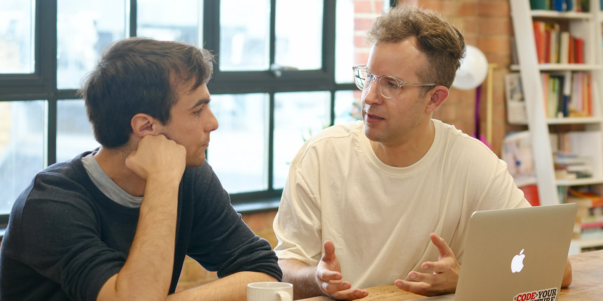 A volunteer and trainee in discussion